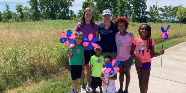 chair-webpage Eleni with Promise Walk family and pinwheels.jpg (56 KB)